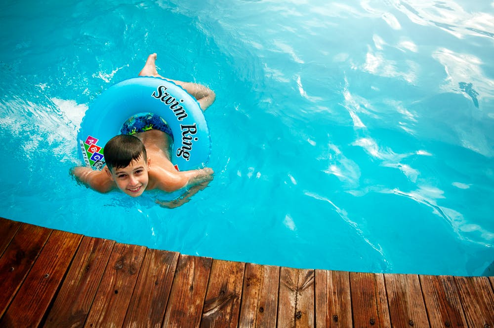 Is it safe to swim in pools or lakes? Does the virus spread through the water?
