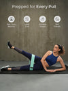 Woman exercising with a resistance band on a yoga mat online - the beach company