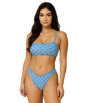 Woman wearing a blue patterned bikini against a plain background - The Beach Company - Online Swimwear Shop