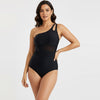 Woman wearing a black one-shoulder swimsuit 