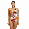 Woman wearing a colorful floral one-piece swimsuit - swimwear shop online - buy swimming costumes near me - the beach company