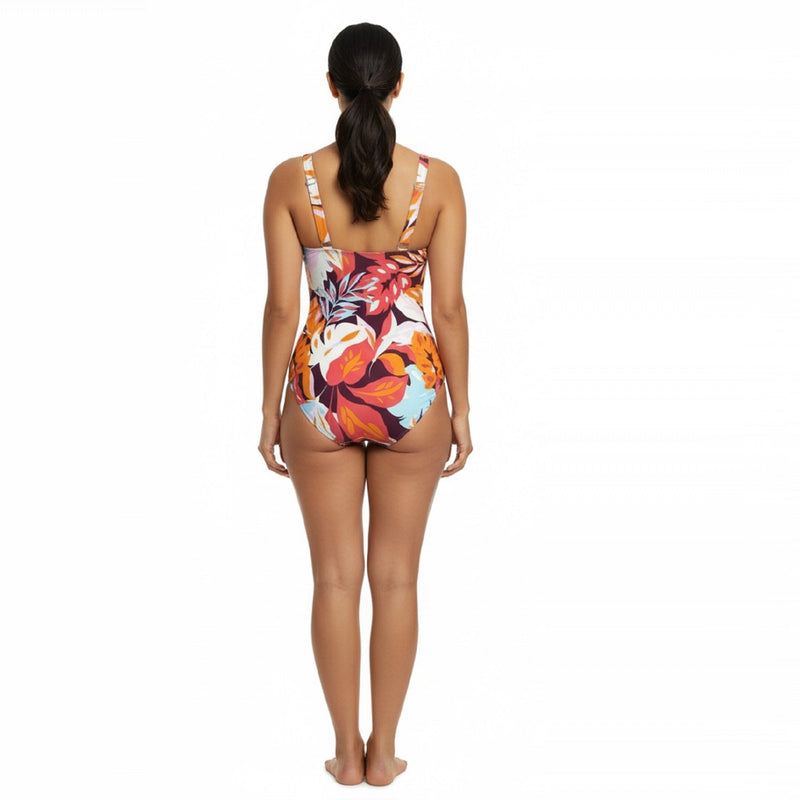 Woman wearing a colorful floral one-piece swimsuit - swimwear shop online - buy swimming costumes near me - the beach company