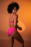 Woman wearing a PINK bikini set - new swimwear designs - buy bikini sets near me - online swimwear shop - THE BEACH COMPANY