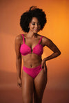 Woman wearing a PINK bikini set - new swimwear designs - buy bikini sets near me - online swimwear shop - THE BEACH COMPANY