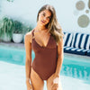 The Beach company online - brown swimsuit - O ring straps - criss cross back - one piece swimwear - plunge neck line swimwear 